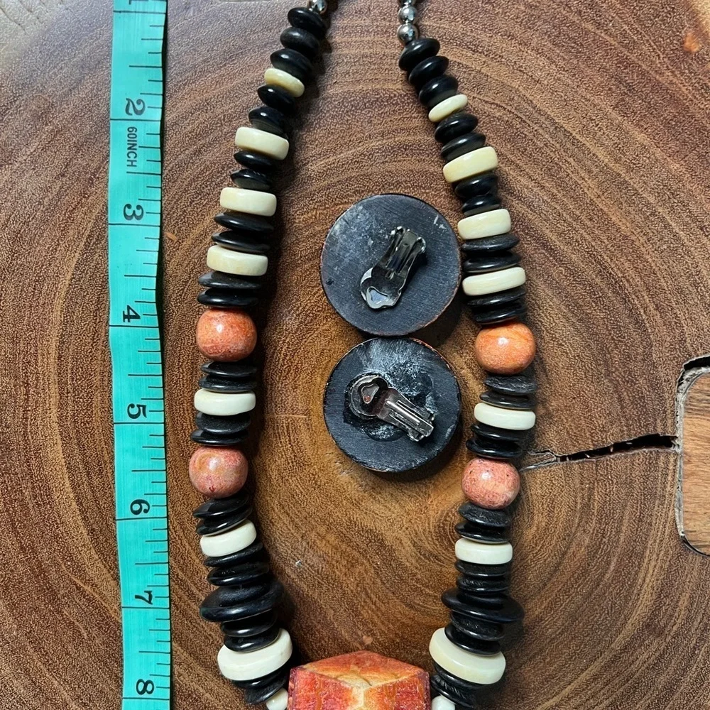 Three piece, rust and black stone and beaded costume jewelry.